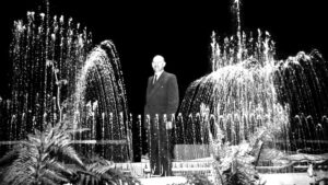 Otto Przystawik standing in a fountain in a black and white photo